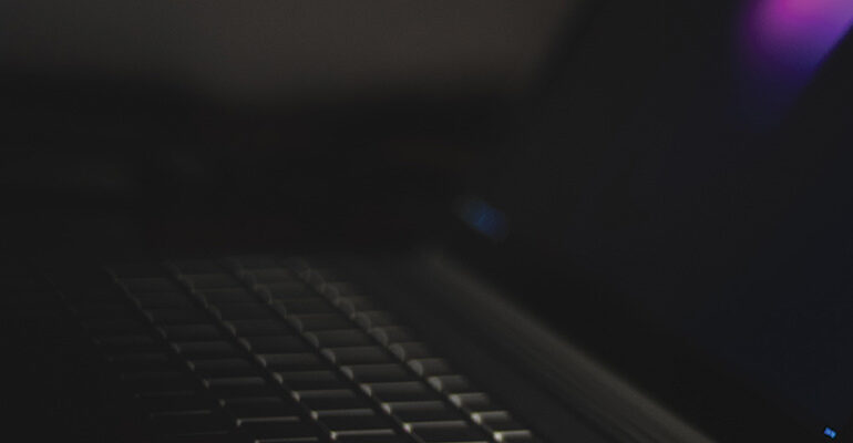 A photo of a black laptop for online payment